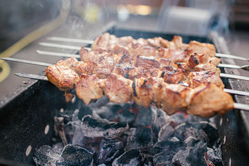 Juicy slices of meat with sauce prepare on fire shish kebab . BBQ outside.
