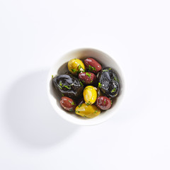 Delicious olive assorti marinated in oil top view