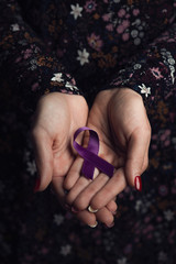 purple ribbon against the violence against women