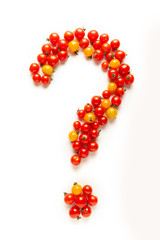 Red and yellow cherry tomatoes, fresh bright organic vegetables. Question mark.