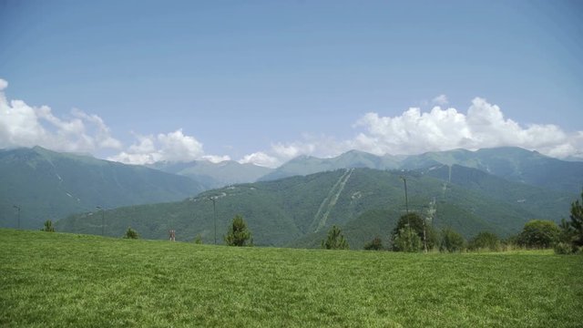 Summer time Mountain nature panoramic landscape in caucasus mountains with blue skay and clouds