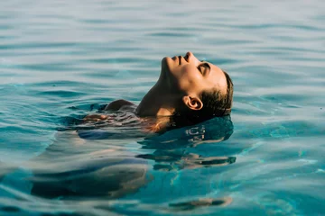 Fototapeten Young woman swim in the swimming pool © F8  \ Suport Ukraine