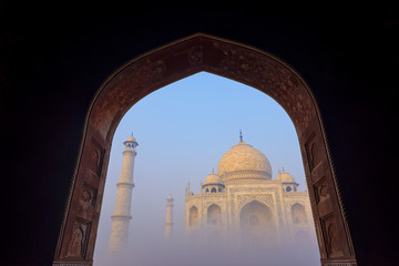 Taj Mahal in the fog at Indian city of Agra, Uttar Pradesh, India.