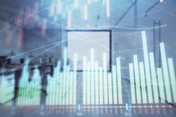 Stock market chart with trading desk bank office interior on background. Double exposure. Concept of financial analysis