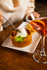 woman eating dessert with pineapple