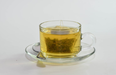 Tea and  Green Tea bag in glass cup is ready to drink