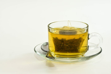 Tea and  Green Tea bag in glass cup is ready to drink