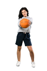 Young woman playing basketball