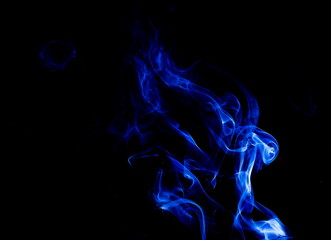 Blue smoke on black background