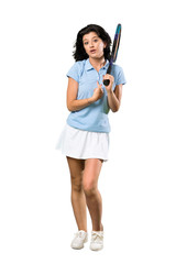 A full-length shot of a Young tennis player woman with surprise facial expression over isolated white background