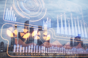 Double exposure of business drawing hologram on cityscape background.