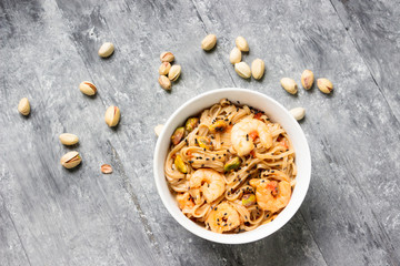Shrimps with soba noodles and shrimps - asian food creative concept.