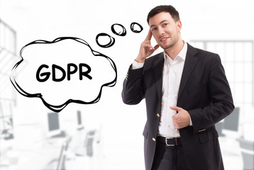Business, technology, internet and network concept. The young businessman comes up with the keyword: GDPR