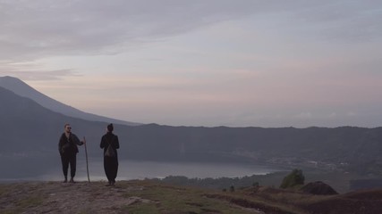Couple meeting sunrise in the mountains