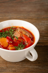 Red ukrainian soup with beef close-up