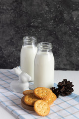 Crispy cracker with milk on a dark background