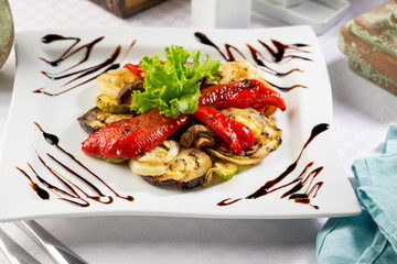 Grilled vegetables set on plate, pepper and eggplant
