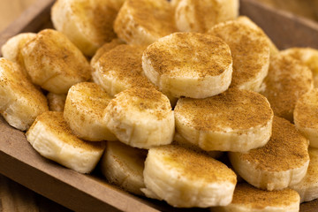 banana slices with cinnamon sprinkled on top