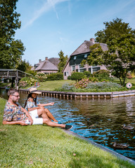 Giethoorn Netherlands, iew of typical houses of Giethoorn. The beautiful houses and gardening city is know as "Venice of the North".
