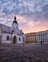 Church of St Mark (Crkva sv Marka) in Zagreb Old city with colourful tiled roof at sunrise. Scenic view of medieval architecture of the historical Upper town (Gradec or Gornij Grad) of Zagreb, Croatia - obrazy, fototapety, plakaty