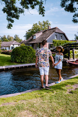 Giethoorn Netherlands, iew of typical houses of Giethoorn. The beautiful houses and gardening city is know as "Venice of the North".