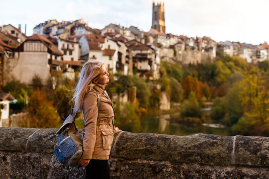 girl in old town in Canton Fribourg, Switzerland, autumn