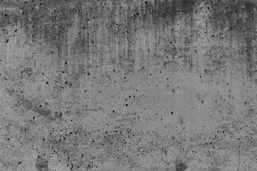 Concrete wall with stains and cracks