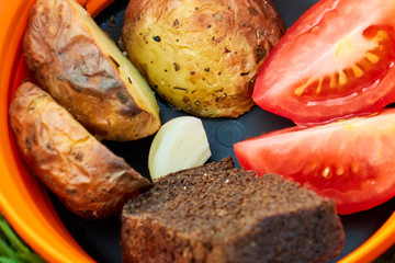 roasted potatoes with vegetables in nature