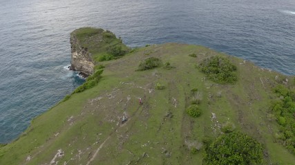 Motorcyclists racing in tropics
