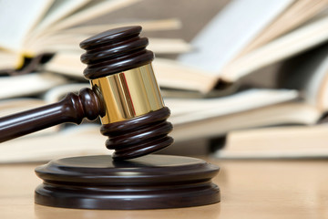 wooden gavel and books