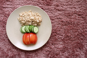 boiled meat chopped with spices and sauce in a plate with chopped vegetables
