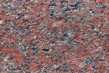 Red granite, which is used in construction.