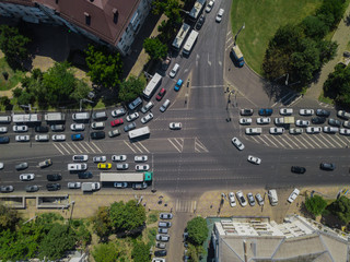 Aerial road abstract: top down view of urban city traffic at rush hour, transportation concept.
