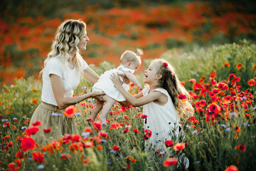 woman is giving her baby to her erder daughter