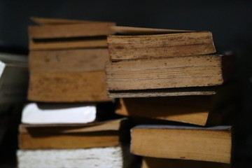 pile of old books on white background