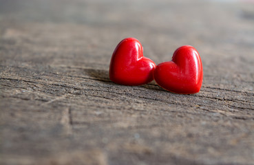 Fototapeta premium Two red heart on wooden background