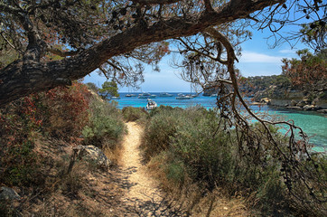 Shady path along the shore of the Bay, Mallorca, Spain