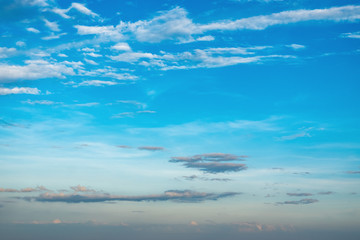 Blue sky and beautiful fluffy clouds in a sunny day.