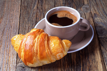 Hot coffee and a croissant
