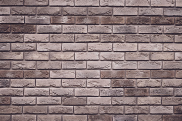 Brown brick wall background. Grunge texture. Vintage rough brickwork. Decorative tile surface. Bricks backgrounds. Messy wall pattern for wallpaper design.