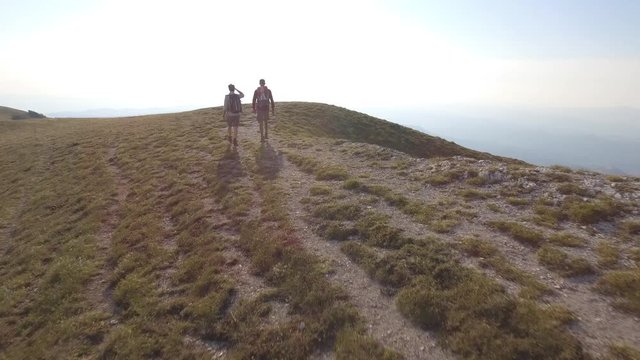 Drone view of two friends hiking in the Apennines, Umbria, Italy