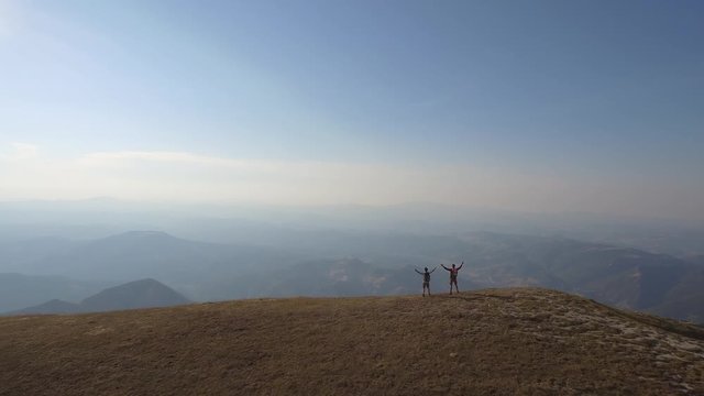 Drone view of two friends hiking in the Apennines, Umbria, Italy