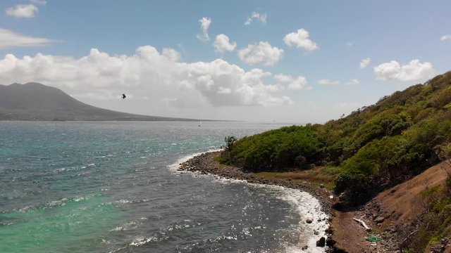 Seabirds plunge dive for fish at Saint Kitts and Nevis, Aerial Fly Over
