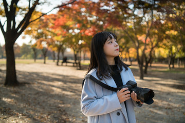 young woman in autumn park