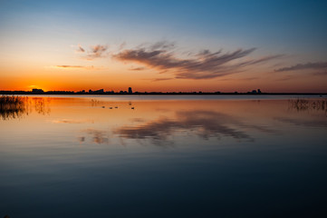 view of a beautiful lake at sunset