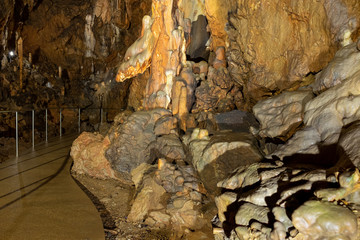 Tourist pathway in he Baradla dripstone cave with the ‘dragon head’ in Aggtelek, Hungary