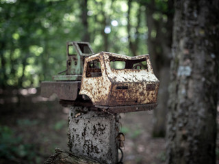 Rusty abandoned car children's toy in Chernobyl Exclusion Zone, Ukraine