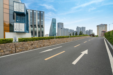 empty highway with cityscape and skyline of qingdao,China.