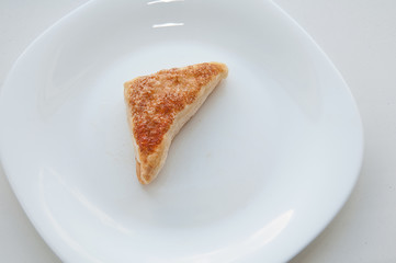 puffs of dough sprinkled with sugar on a white plate