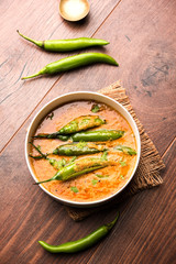 Hyderabadi mirch/mirchi ka Salan or green chilly sabzi or curry. Main course recipe from India. served in a bowl. selective focus